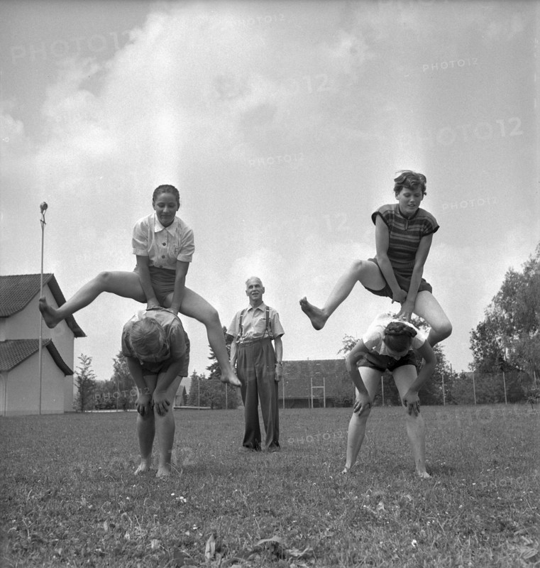 Wangi, teacher giving an outdoor gym lesson, 1955