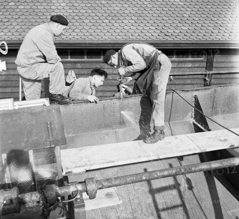 Preparation of overland ship transpor, cutting hull in two with blowtorch, 1946