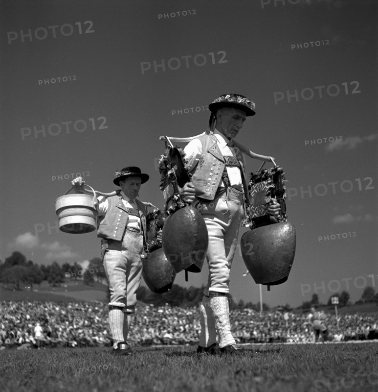 Swiss wrestling festival 1948 in Lucerne:men in traditional costume with bells