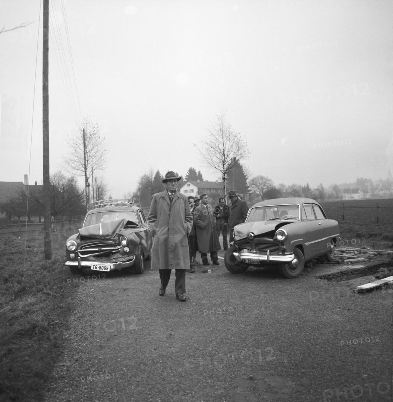 Cars damaged in a head-on collision in Elgg 1957