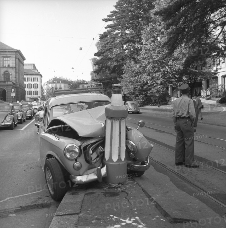 Car clash into road safety pile, traffic island on Universitatsstrasse Zurich 1959