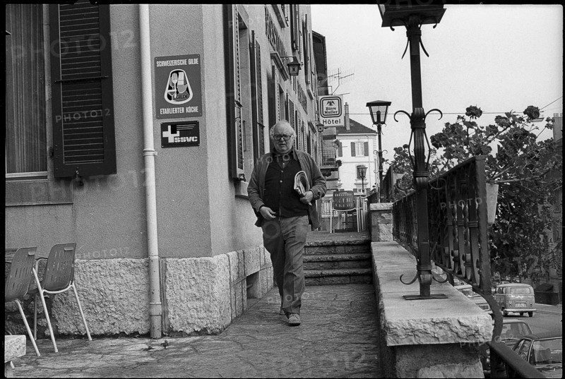 Swiss writer Friedrich Duerrenmatt leaving hotel restaurant ""Du Rocher"", Neuchatel 1977