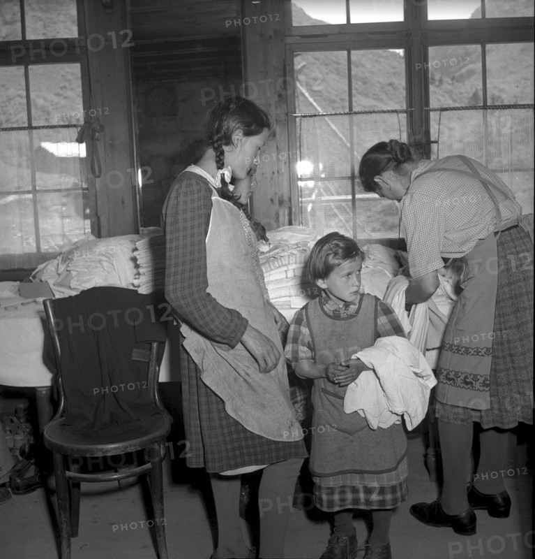 Relief supplies, clothes for the population of the completely burned down hamlet Selva 1949