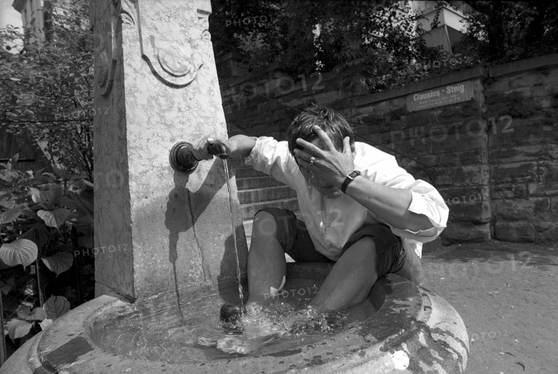 Heat in Zurich, young man cooling down 1970