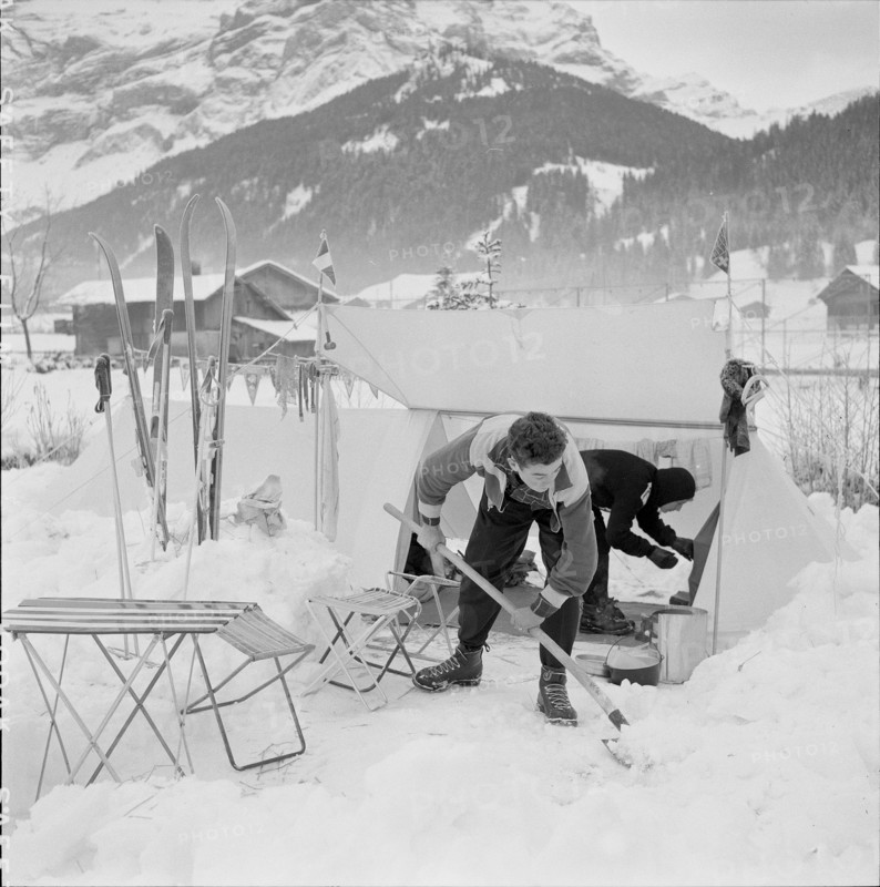 14th Swiss New Year's tent camp in Les Diablerets 1957: shoveling snow