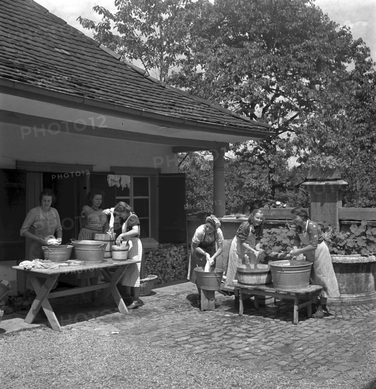 Washing clothes outdoor at women's school 'Heim' in Neukirch an der Thur, 1940