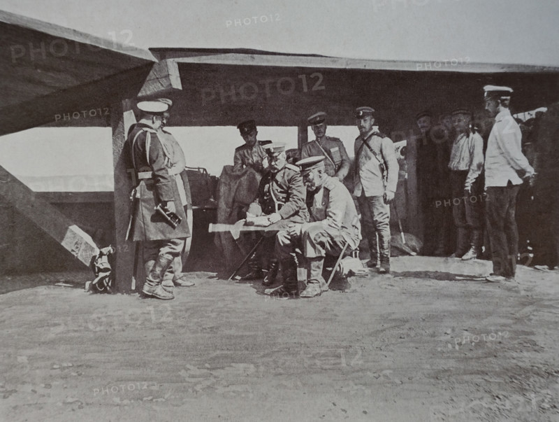 General Stessel and General Fock are sitting at the plan, General Kondratenko is standing at the column  Russo-Japanese War