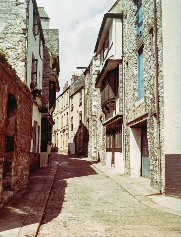 Historic buildings cobbled street  including listed Elizabethan House with distinctive jettied.