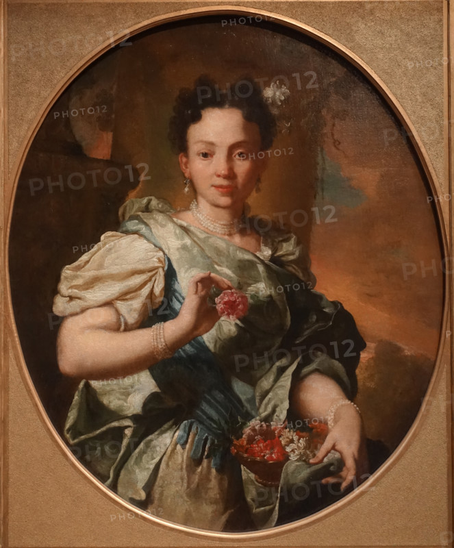 A young girl with a flower basket.