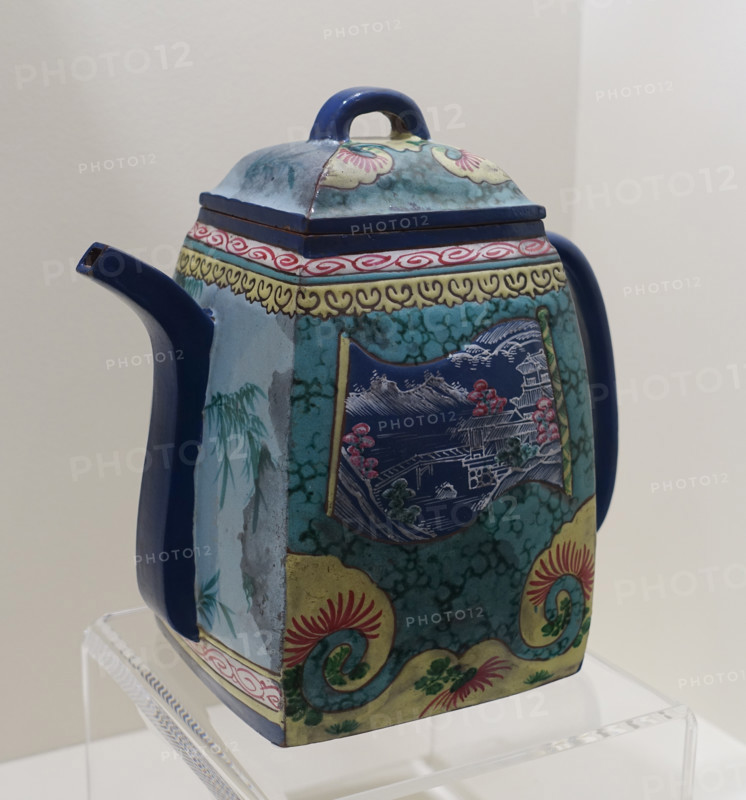 Teapot with a landscape and calligraphic inscription.