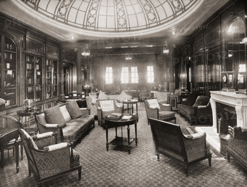 Cunard Line promotional brochure for 'Mauretania' circa 1930. The library and writing room.