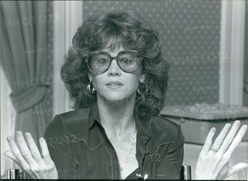 Actress Jane Fonda gesturing with her hands, wearing glasses