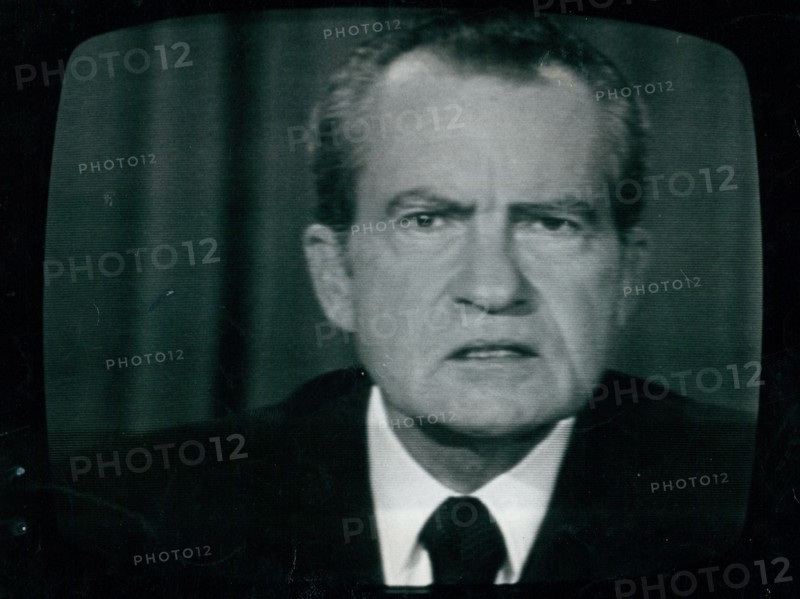 Photograph of President Richard Nixon close-up on television resigning from office