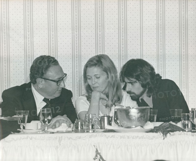 Henry Kissinger, Faye Dunaway and husband Peter Wolf at a party