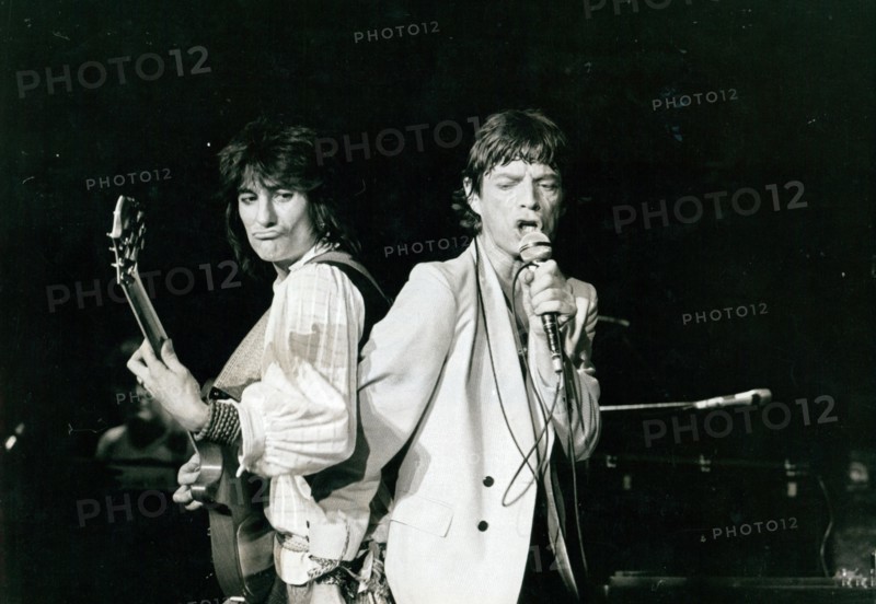 Ron Wood and Mick Jagger performing at a Rolling Stones concert