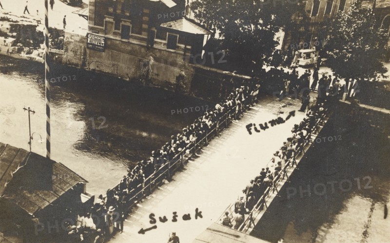 Croatia, Fiume the border bridge that divided Italy from Yugoslavia, on the backgroung a Gomme Pirelli sign showing italian activities in Susak, 1927 circa.