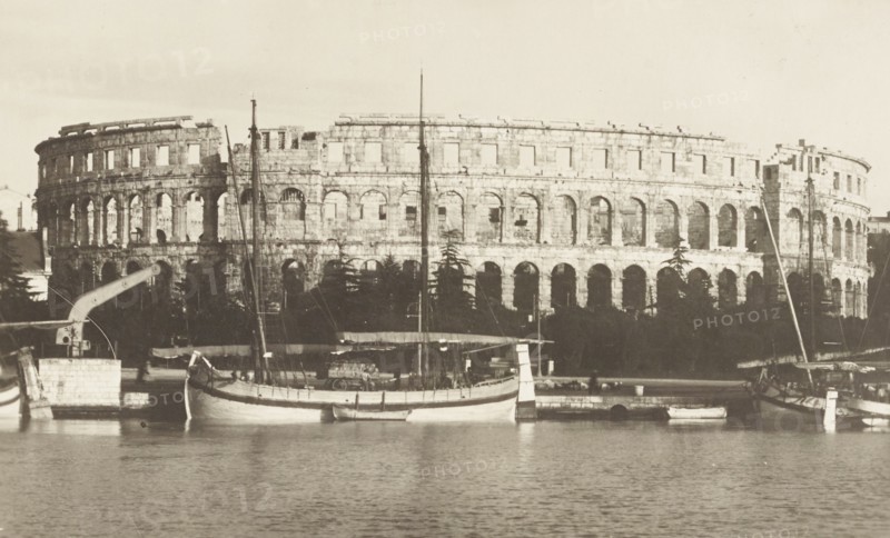 Croatia, The Pula arena with sailboats moored, 1910 circa