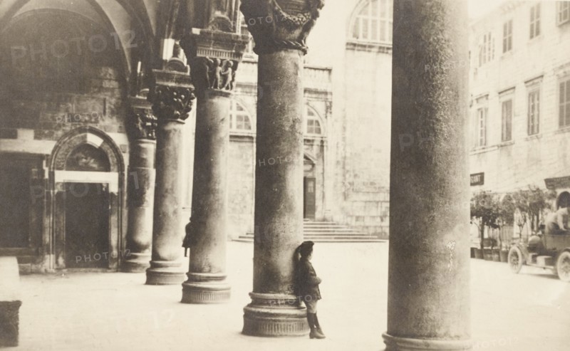 Croatia, Dubrovnik, Ragusa, young boy in the outer porch of the Rector's Palace Knezev dvor, 1920 circa