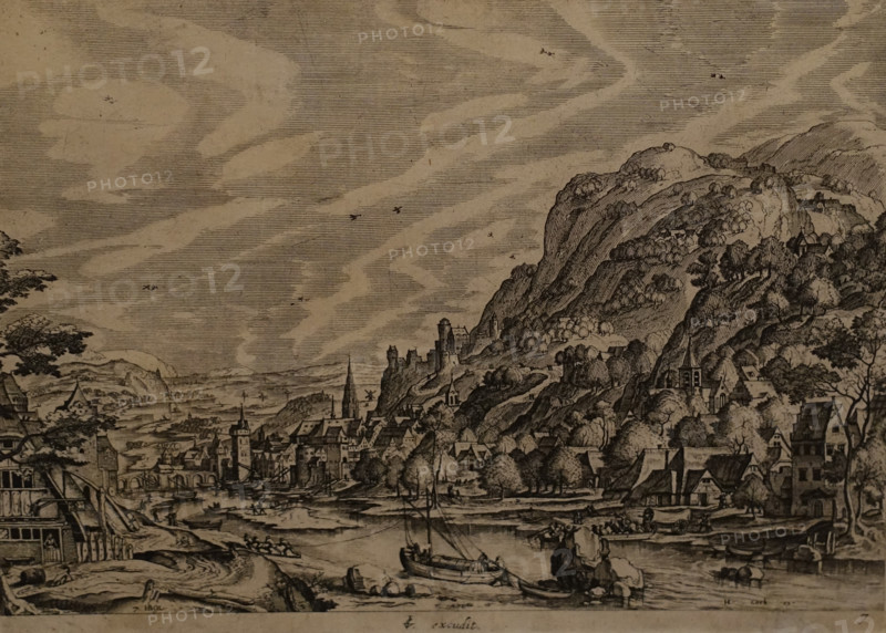 River landscape with a barge in the foreground