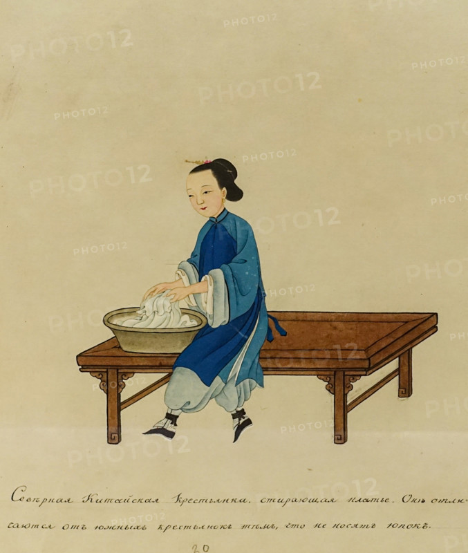 Northern Chinese peasant woman washing a dress