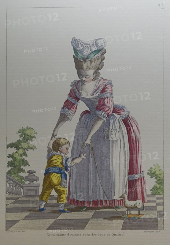 Governess and a child in a yellow suit