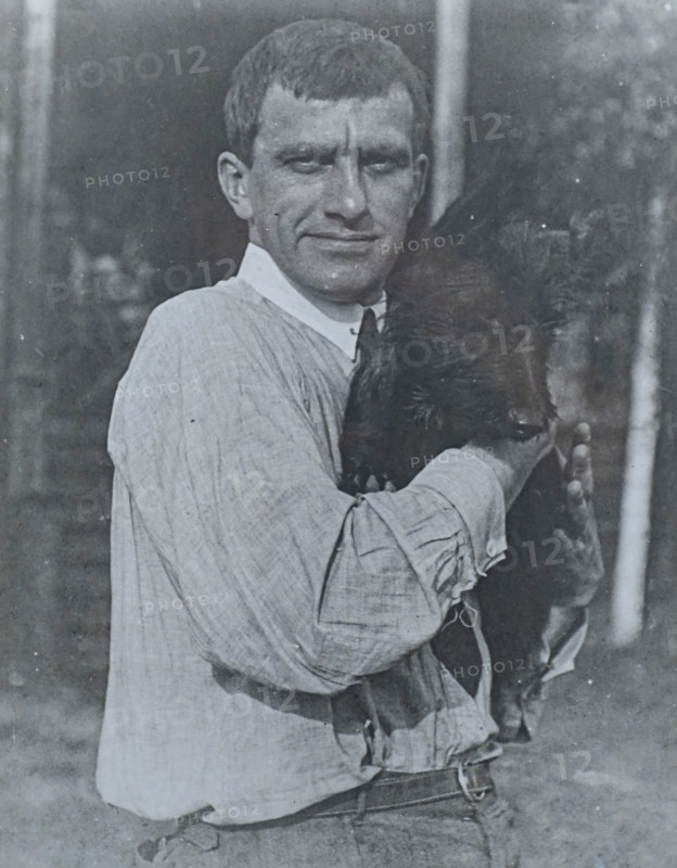 Portrait of Mayakovsky Vladimir Vladimirovich (1893-1930) with dog Scottic