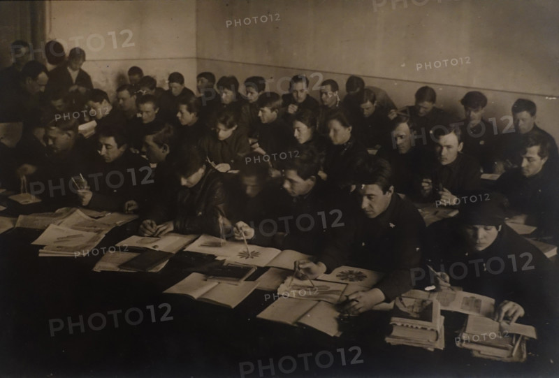 Yakov Chernikhov (1889-1951) teaches a class on descriptive geometry at the workers' faculty