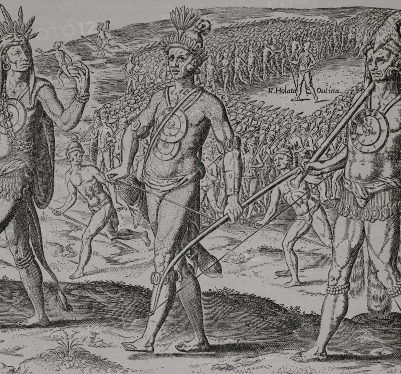 Second expedition of Rene de Goulaine de Laudonniere (c. 1510-1574) to Florida, 1564. The Olata Utina chieftain leading his warriors, marching in battle formation to engage his Saturiwa enemies. Facsimile of an engraving by Theodor de Bry (1528-1578) after Jacques Le Moyne de Morgues (1533-1588), 1591, from ""Brevis narratio eorum quae in Florida Americae provincia Gallis acciderunt..."". ""America. History of its discovery from primitive times to the modern era"", written by Rodolfo Cronau. Volume II. Published in Barcelona, 1892.