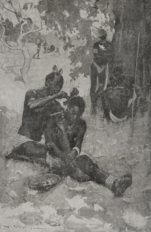 Africa. Gani tribe. Placing a headdress. Illustration by W. Hatherell (1855-1928). Photogravure by Andre & Sleigh. ""La conquista de Africa"" (The conquest of Africa), by Alfredo Opisso. Volume II. Published in Barcelona (Spain) by Molinas y Maza editores, 1911.