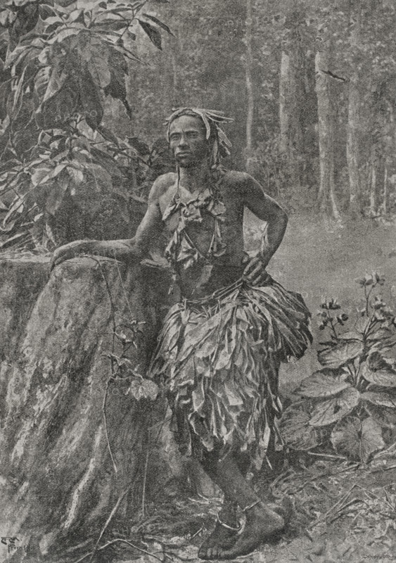 Lower Congo Chief in royal robes. Photogravure by Andre & Sleigh from a photograph by the Rev. S.D. Darby. ""La conquista de Africa"" (The conquest of Africa), by Alfredo Opisso. Volume II. Published in Barcelona (Spain) by Molinas y Maza editores, 1911.