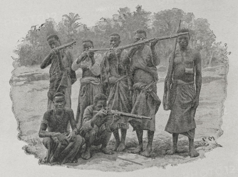 Mozambique. Wa-Yao hunters. Photogravure from photograph by the Universities' Mission to Central Africa. ""La conquista de Africa"" (The conquest of Africa), by Alfredo Opisso. Volume III. Published in Barcelona (Spain) by Molinas y Maza editores, 1911.
