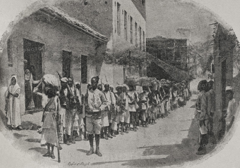 Uganda. British East Africa. Imperial British East Africa Company (1888-1896). Despatch from the coast of special mail carriers, with instructions to hold Uganda for a further period of three months. Photogravure by Andre & Sleigh from a photograph taken for the Imperial British East Africa Company. ""La conquista de Africa"" (The conquest of Africa), by Alfredo Opisso. Volume III. Published in Barcelona (Spain) by Molinas y Maza editores, 1911.