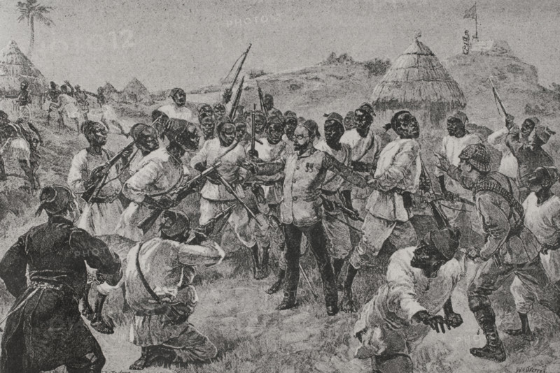 Emin Pasha Relief Expedition (1887-1889). Mutiny of Emin Pasha's soldiers in Labore: beginning of the rebellion. Equatorian officers rebelling against Emin Pasha during the reading of the Khedive's instructions. They were given two choices: follow Emin to Egypt via Zanzibar and remain in the Khedive's army, or stay in Equatoria and cease to be Egyptian soldiers. The soldiers did not trust Emin. If they had to march, it would be north, only to Egypt. They believed that the Khedive would soon send them a steamer with the true governor, as well as fresh food. The incident was provoked by the Bari soldiers acussing Emin Pasha (centre of the image) of lying to them in order to turn them against their compatriots. The Pasha was trying to gather forces to recover his position as governor after being overthrown by Mahdist forces. The mutiny ended when one of the Governor's soldiers threatened to light the stores of gunpowder. Photogravure after an illustration by William Heysham Overend (1851-...