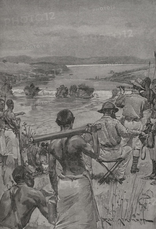 Speke and Grant at Ripon Falls, where te Nile flows out of Victoria Nyanza. Photogravure after an illustration by R. Atkinson. ""La conquista de Africa"" (The conquest of Africa), by Alfredo Opisso. Volume III. Published in Barcelona (Spain) by Molinas y Maza editores, 1911.