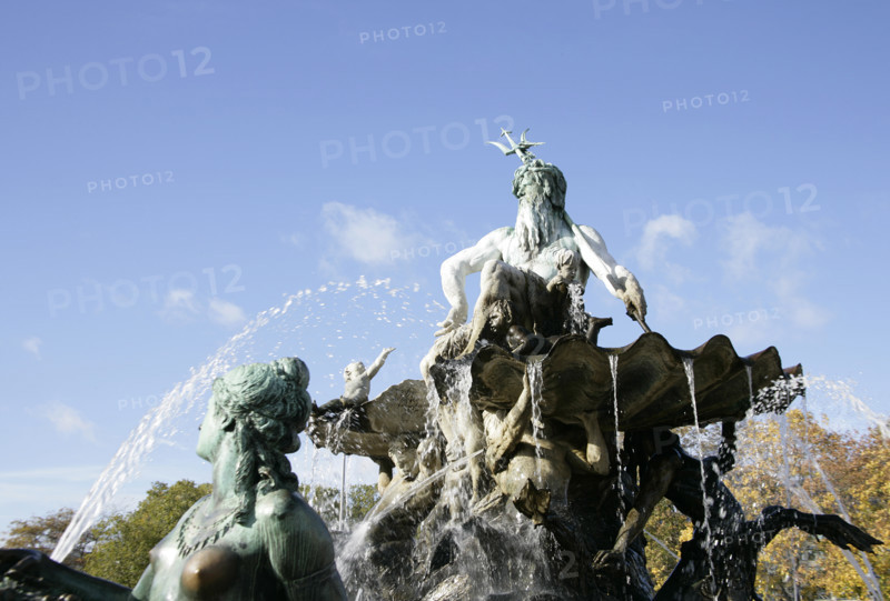 Berlin, Germany. Neptune Fountain (Neptunbrunnen). Designed by Reinhold Begas (1831-1911) and inaugurated in 1891, the fountain was moved from its original location at the Schlossplatz in 1951 when the former Berliner Schloss (Berlin Palace) there was demolished. After being restored, it was moved in 1969 to its present location between St. Mary's Church (Marienkirche) and the Red Town Hall (Rotes Rathaus). The Roman god Neptune is in the center. The four women around him represent the four main rivers of Prussia at the time of its construction: Elbe, Rhine, Vistula and Oder. Detail. In the foreground, female sculpture representing the Rhine.