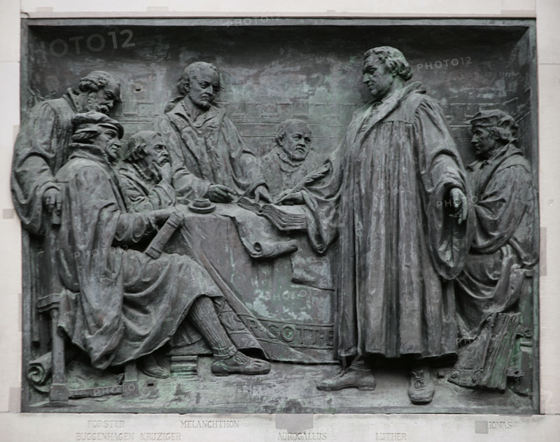 Martin Luther (1483-1546). German theologian and Augustinian friar. Luther among the Reformers. Depicted from left to right: Johann Forster (1496-1556), Johannes Bugenhagen (1485-1558), Caspar Cruciger the Elder (1504-1548), Philipp Melanchthon (1497-1560), Matthaus Aurogallus (1490-1543), Martin Luther, and Justus Jonas the Elder (1493-1555). Relief on the right side of the main entrance to Berlin Cathedral, created by German sculptor Johannes Gotz (1865-1934), 1904. Germany.