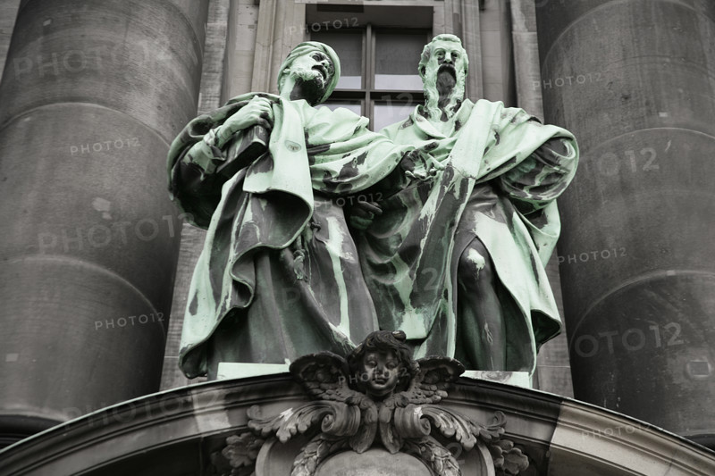 Germany. Berlin Cathedral (Berliner Dom). Temple inaugurated in 1905. It was built by order of Emperor Wilhelm II (1859-1941) between 1894 and 1905, under the direction of German architect Julius Carl Raschdorff (1823-1914). Also known as the Evangelical Supreme Parish and Collegiate Church, it is a monumental German Protestant church and dynastic tomb (House of Hohenzollern). Statues representing Saint Matthew (left) and Saint Mark (right) on the main facade. Sculpted in copper by German sculptors Gerhard Janensch (1860-1933) and Johannes Gotz (1865-1934).