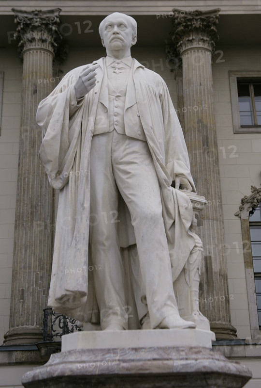 Hermann von Helmholtz (Hermann Ludwig Ferdinand von Helmholtz) (1821-1894). German physicist and physician. Statue of Helmholtz in front of the entrance to Humboldt University in Berlin, Germany. Created by Ernst Herter (1846-1917) in 1899.