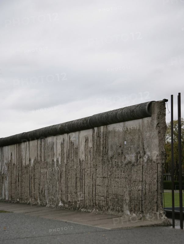 Berlin Wall, Germany. Its construction began on 13 August 1961, and it fell on 9 November 1989. The government of the German Democratic Republic (GDR) built this barrier, more than 150 km long, to completely isolate East Berlin from the rest of the GDR. Berlin Wall Memorial on Bernauer Strasse. Section located on Bernauer Strasse, border between the districts of Mitte (East Berlin) and Wedding (West Berlin).