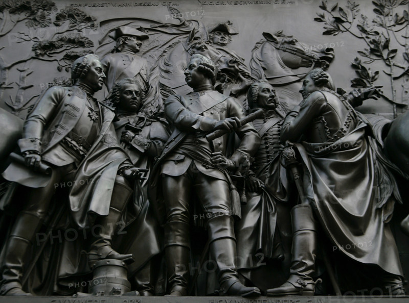 From left to right: Friedrich Leopold von Gessler (1688-1762), Prussian field marshal; Carl Heinrich von Wedel (1712-1782), Prussian General; Leopold II, Prince of Anhalt-Dessau (1700-1751) and Prussian General; Hartwig Karl von Wartenberg (1711-1757), Royal Prussian major general and Proprietor (Inhaber) of the Hussars Regiment No. 3; and Karl Christoph von der Goltz (1707-1761), Prussian lieutenant general. Detail from the monument to Frederick the Great, erected on Unter den Linden Avenue, Berlin, Germany. Made in bronze between 1839 and 1851 by German sculptor Christian Daniel Rauch (1777-1857).