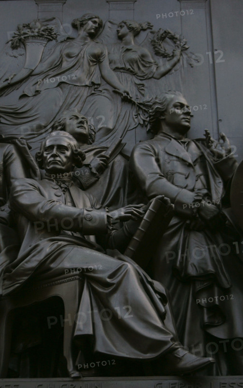 From left to right: Carl Heinrich Graun (1704-1759), German composer and tenor; and Gotthold Ephraim Lessing (1729-1781), German writer, dramatist, and art critic. Behind both, Johann Heinrich von Carmer (1720-1801), Prussian judicial reformer. Figures from the monument to Frederick the Great, erected on Unter den Linden Avenue, Berlin, Germany. Made in bronze between 1839 and 1851 by German sculptor Christian Daniel Rauch (1777-1857).