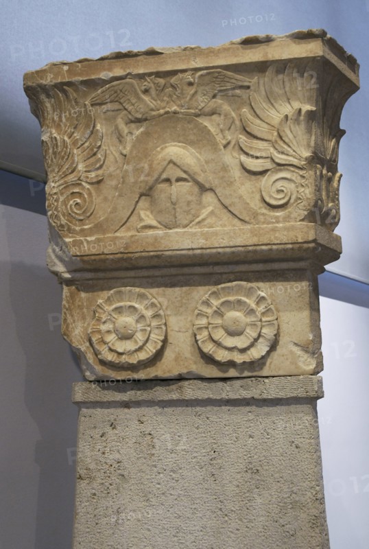 Detail of the upper part of a three-sided funerary stele, which probably belonged to a War Memorial. The names of the dead were inscribed on the body of the stele, below the rosettes. Second half of the 4th century BC. Archaeological Museum of Piraeus. Greece.