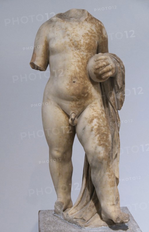 Statue of a small boy holding a ball; votive offering to a certain sanctuary in Piraeus. Hellenistic period (323 BC-30 BC). Archaeological Museum of Piraeus. Greece.