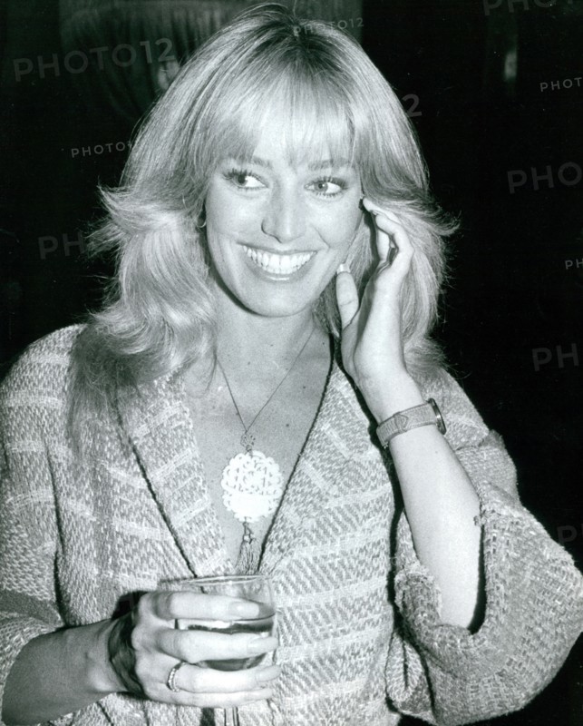 Susan Anton with a drink