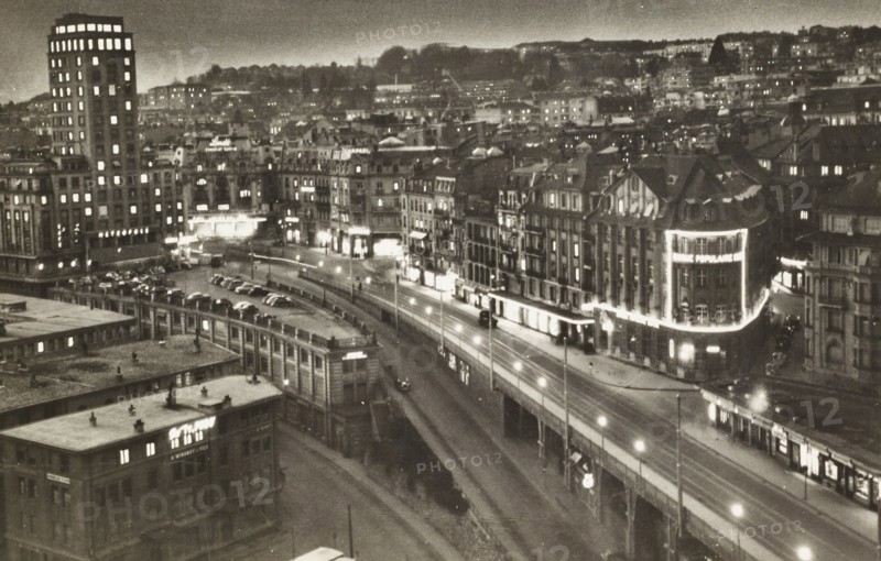 Vintage night photograph depicting the center of Lausanne Switzerland