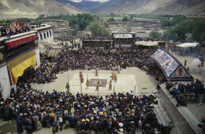 CHINA, Tibet, Samye Monastery, Crowds and dancers at Tibetan Full Moon Festival.