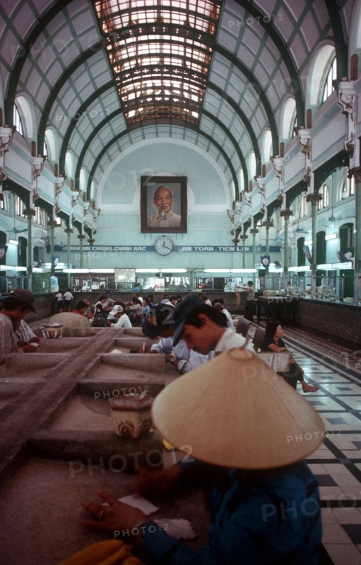 VIETNAM, Ho Chi Minh City, Post Office interior depicting glass canopy and iron framed roof.