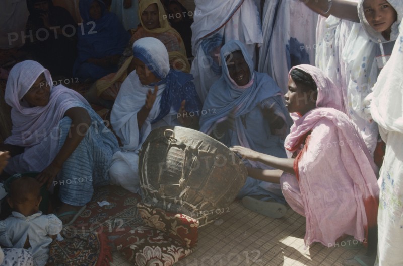 MAURITANIA, Atar, Women sitting around Womans Day drum