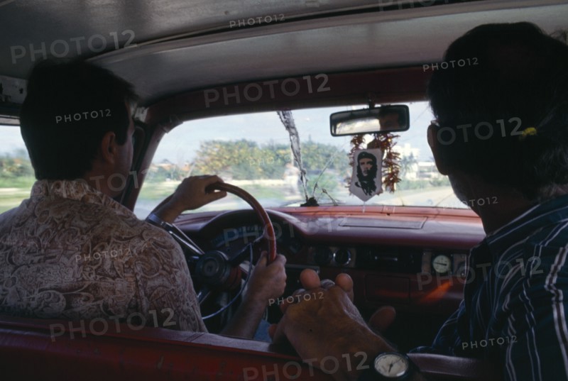 CUBA, Transport, Interior of car with image of Che Guevara hanging beneath front windowscreen mirror.