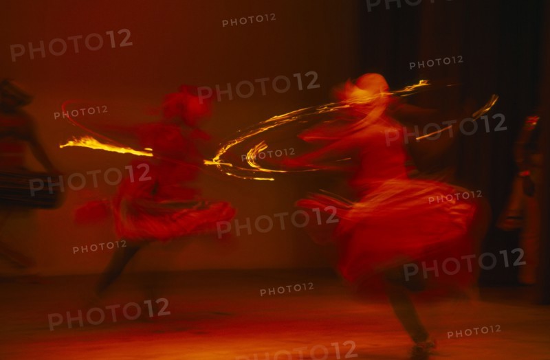 SRI LANKA, Kandy, Kandy dancers in movement blur